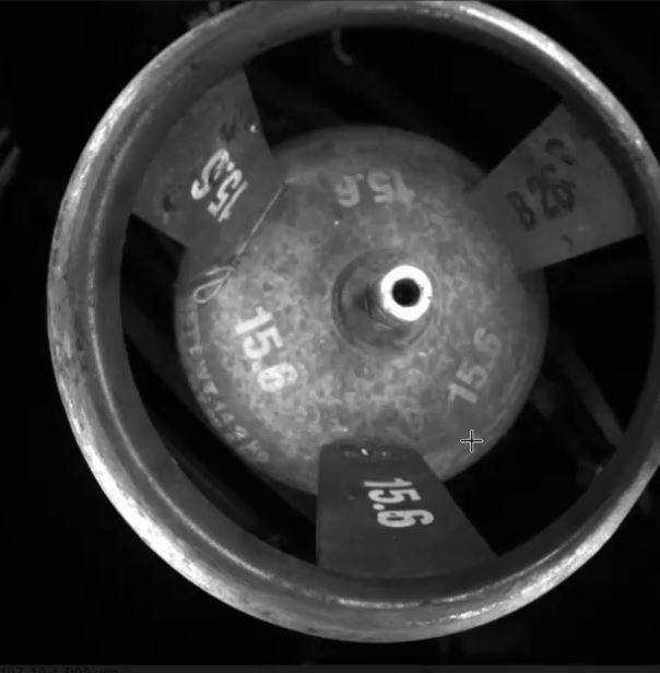 Camera image of a cylinder top view. Characters to be read are “15.6” and “B 26”