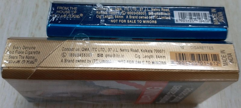 Printed codes and text on the side panels of two cigarette packs